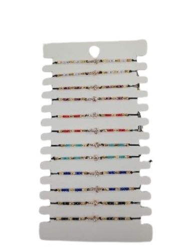 Pulsera cuerda cristales peq. surt. con cruz (paq.12)